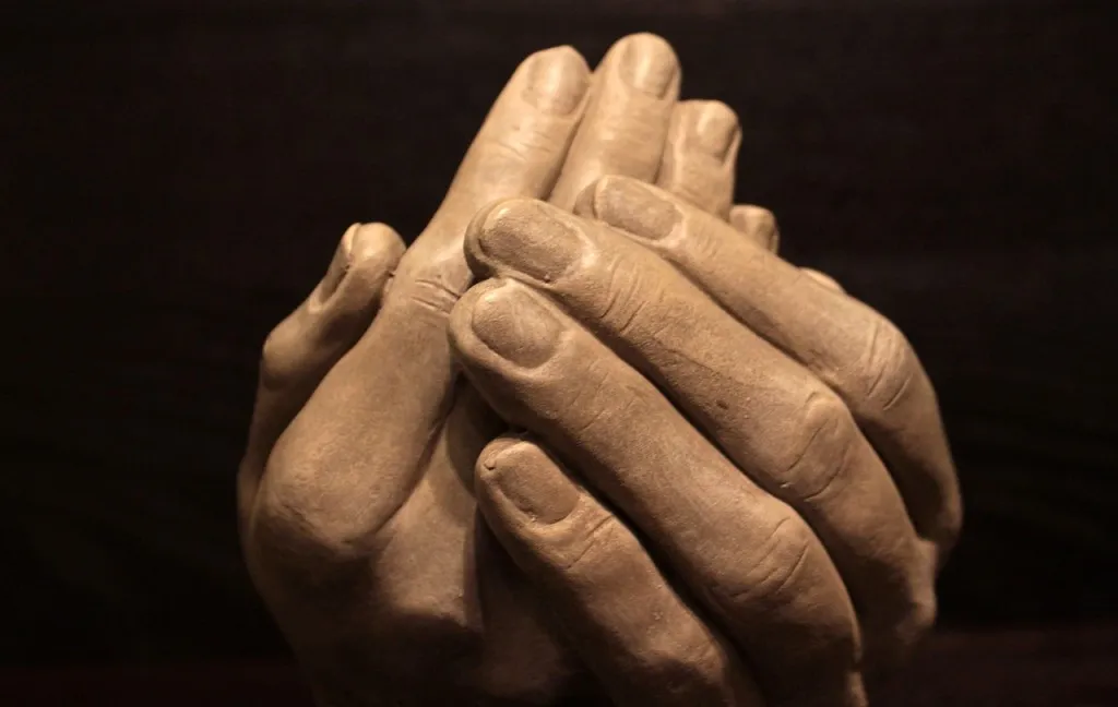 kindness as shown by interwoven hands