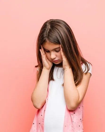 touching temples and having headache.