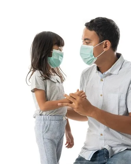 worried father and daughter wearing face mask