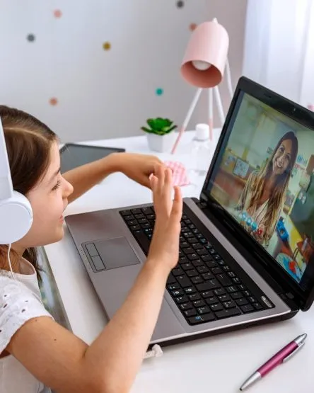 Girl watching online class of her teacher