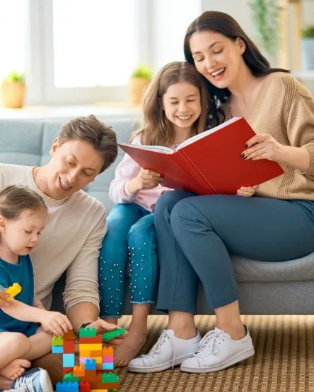 Happy family playing at home.