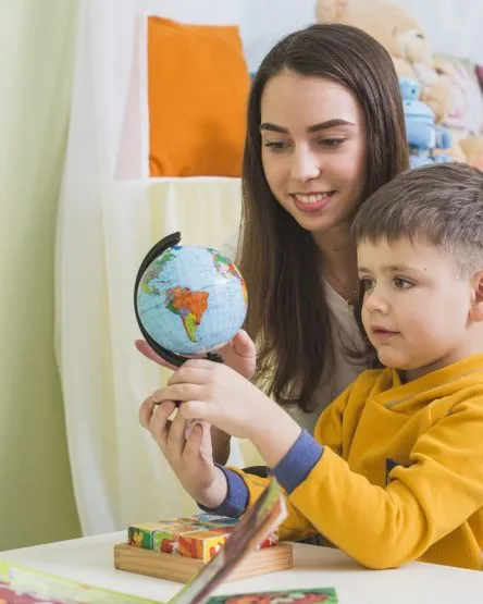 mom-teaching-son-globe