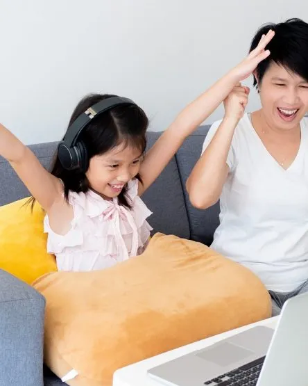 Cute asian girl and her teacher use notebook for studying online
