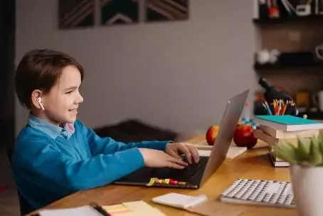 Online learning, boy using laptop for his classes